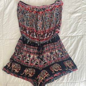 Strapless urban outfitters romper with tie waist and pockets.